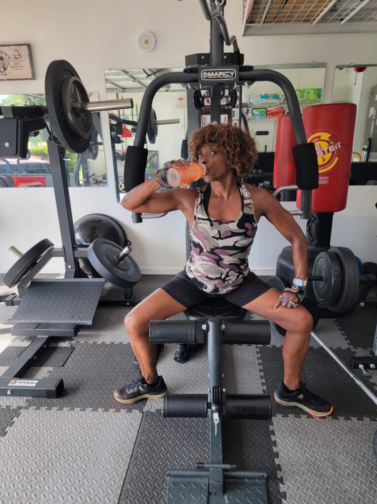 Dr. Cynthia Simon, drinking water in a gym