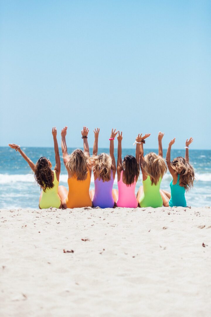 girls raising their hands up