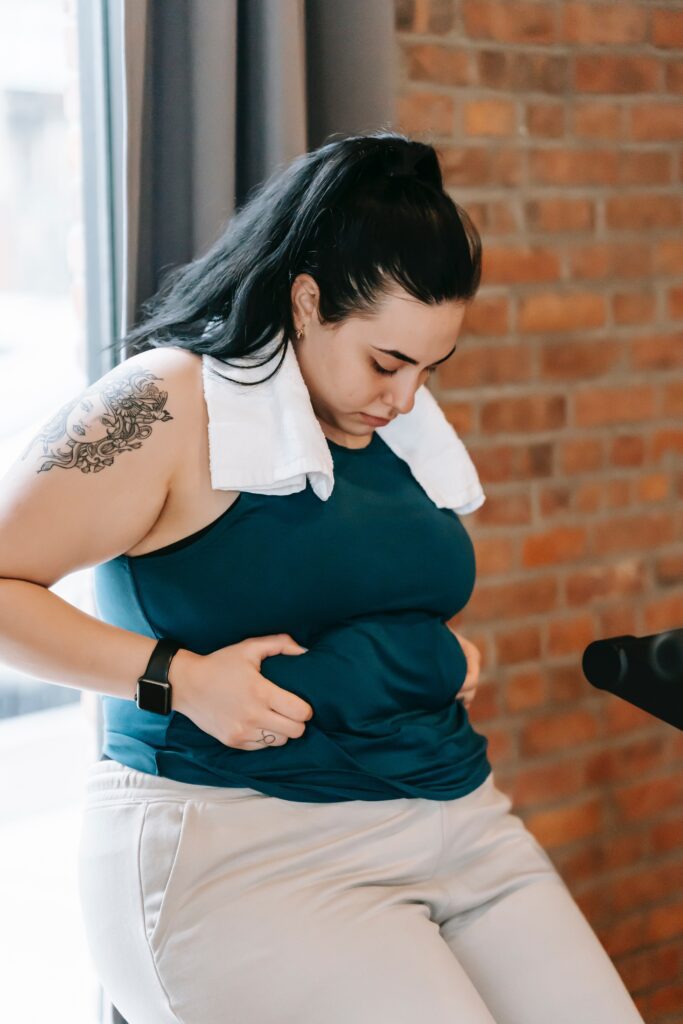 A woman squeezing her stomach