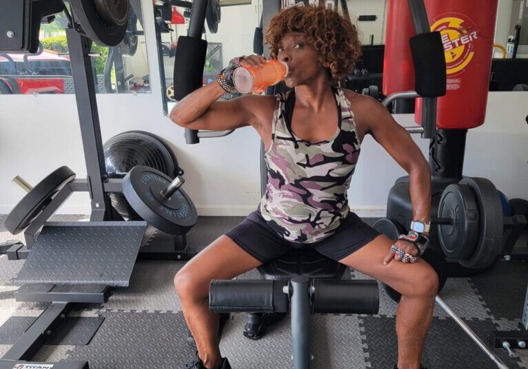 Dr. Cynthia Simon, drinking water in a gym